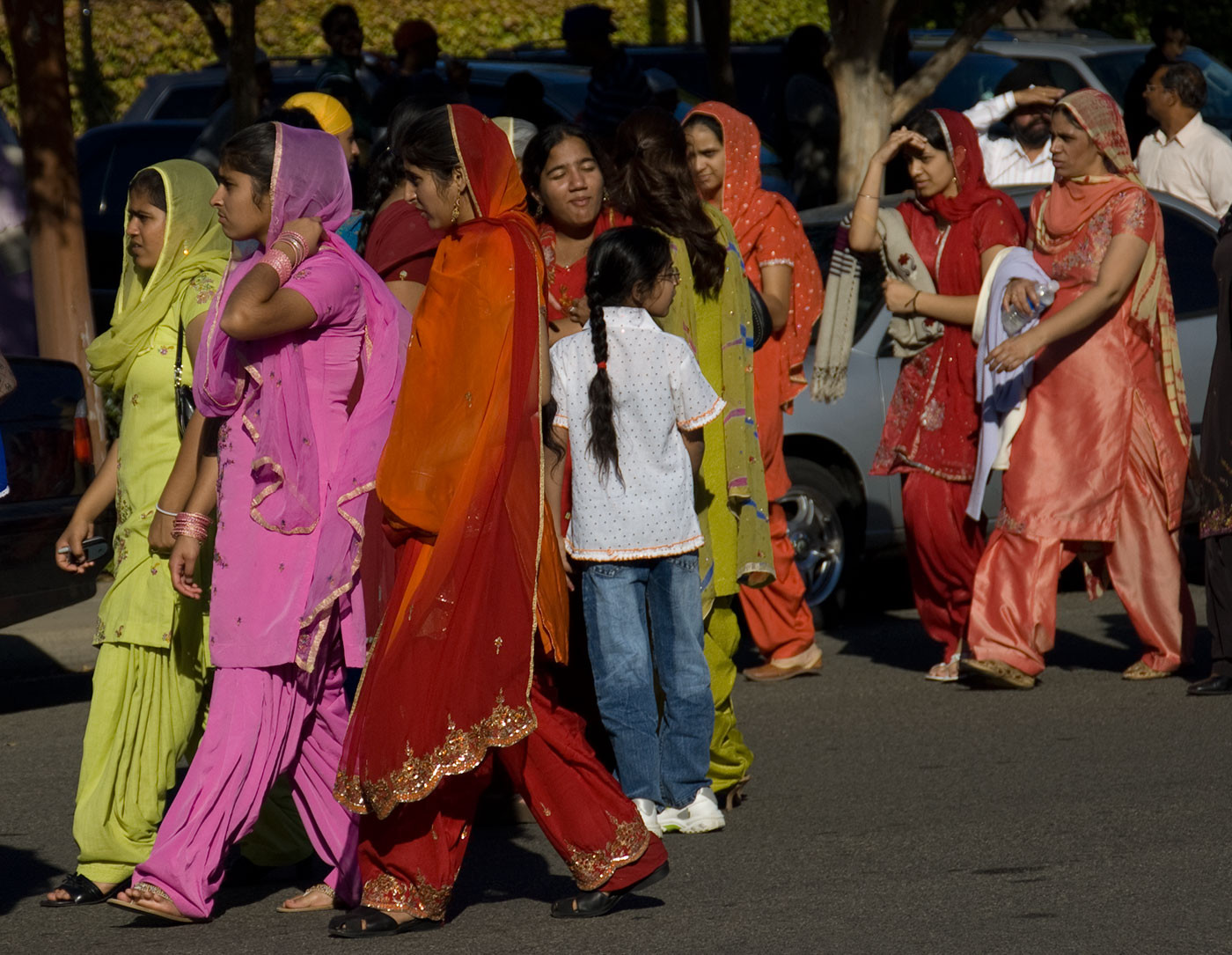 Photo of a group of colorfully dressed women in Yuba City during a parade by Marge d'Wylde